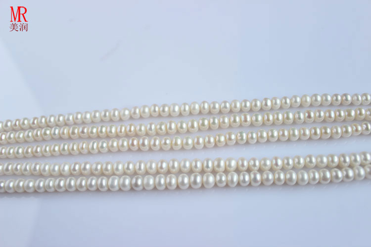 5-6mm White Freshwater Pearl Strands, Button Round (ES117)